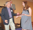 Kimberly Hall receiving award from Dr. Brian Spooner