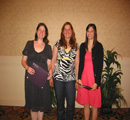 Amy Hurt (L) & Melanie Katz (R) receive award from Amber Kozak