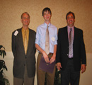 Jared Wilmoth (center) presented award by Charles & Charlie Bascom