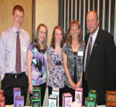 Mason Wolfe & family with toys she sells to raise funds for the Center