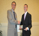 Center Assoc. Dir. Keith Chapes presents award to Parker Rayl