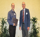 Lincoln Diehl presents award to Taylor Kinney