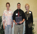 Jan Woodyard & Eleonor Deebler present award to Luis Chavez