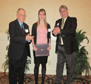 Katie George receives award from Sunny 102.5's Ken Jennison & John Anderson.