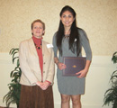 Stephanie Jacquez receives award from Assoc. Dean of Arts & Sci Beth Montelone.