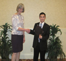 Van Bui receives award from Loretta Hoerman.