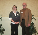 Angela Grommet receives award from Ken McCosh.