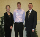 Scott Jones receives an award from Fran & Chuck Veatch.