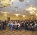 Roomful of students & their guests, faculty mentors & center supporters